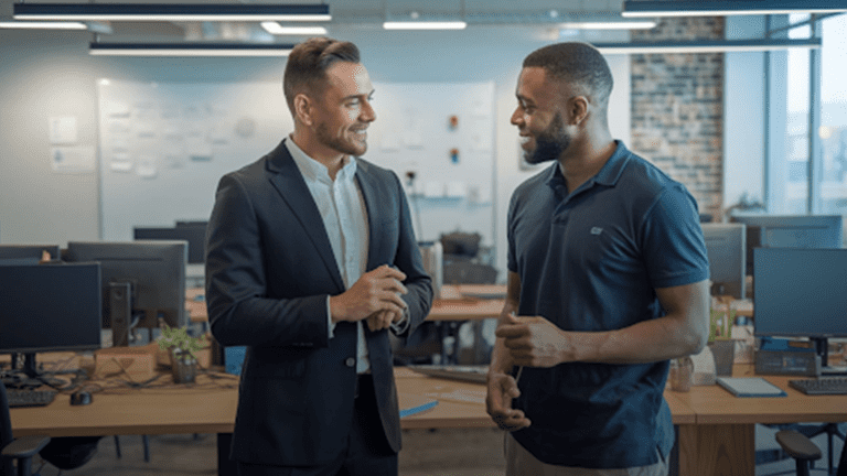 Two-men-engaged-in-conversation-inside-a-modern-office-setting,-discussing-custom-software-development-matters