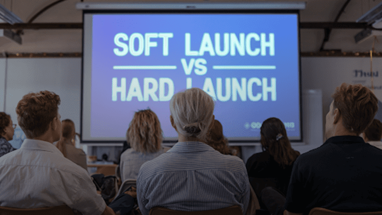 People-sitting-in-front-of-screen-learning-about-Soft-Launch-vs-Hard-Launch.