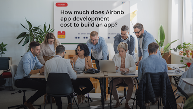 Team-discussing-Airbnb-app-development-costs-in-a-modern-office-setting.